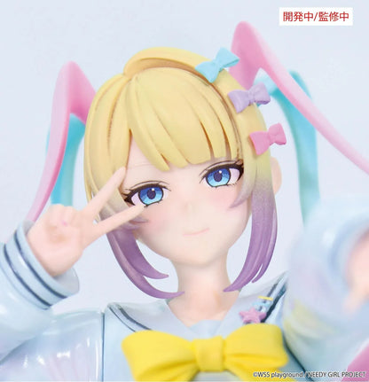 Prototype NEEDY GIRL OVERDOSE Vivit INTERNET ANGEL figure in a pale blue outfit with a yellow bow, spiraling pink-and-turquoise hair, and a peace-sign pose.