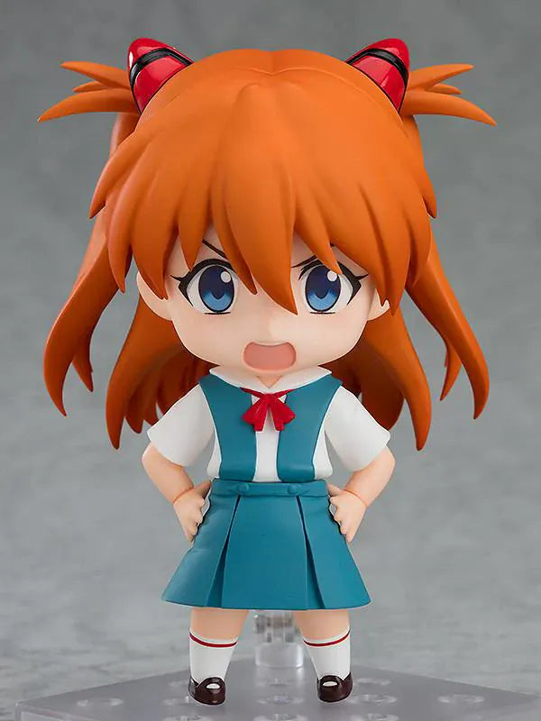 Rebuild of Evangelion Nendoroid Asuka Shikinami Langley Figure Rerelease featuring Asuka with orange twin tails, blue eyes, school uniform, and cheerful waving pose.