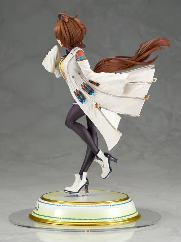 Agnes Tachyon 1/7 scale figure wearing an oversized white laboratory coat, yellow sweater, and dark tights on a decorative base.