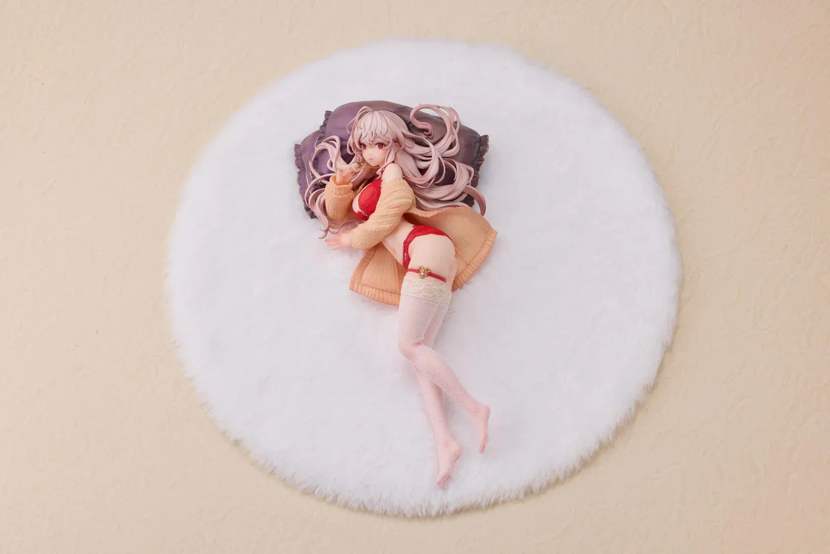 Makia 1/7 scale figure lying on a large fluffy white round base, wearing a cardigan and red lingerie, resting on a purple pillow