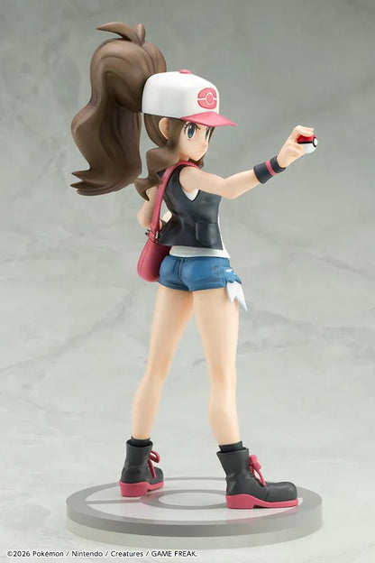 Pokemon ArtFX J Hilda with Tepig 1/8 Scale Figure Rerun featuring Hilda in her trainer outfit holding a Poké Ball with Tepig and flame effect on a display base.