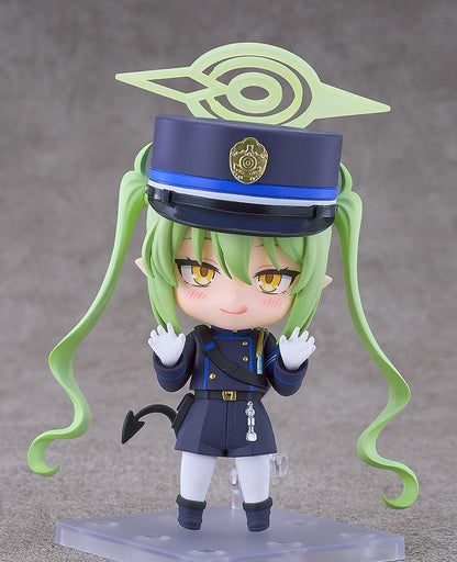 Blue Archive Nendoroid Nozomi Tachibana Figure featuring Nozomi with light green twin tails, golden eyes, oversized officer cap, academy uniform, and halo-style effect piece.