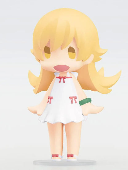 Monogatari Series HELLO! GOOD SMILE Shinobu Oshino Figure featuring a blonde-haired anime girl with golden eyes, a cheerful expression, white dress decorated with red bows, and matching shoes in a cute chibi design.