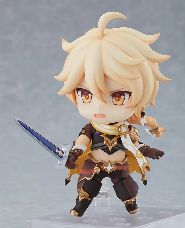 Genshin Impact Nendoroid Traveler Figure Aether Rerelease featuring Aether with blonde hair, golden eyes, fantasy outfit details, yellow cape, and sword accessory.