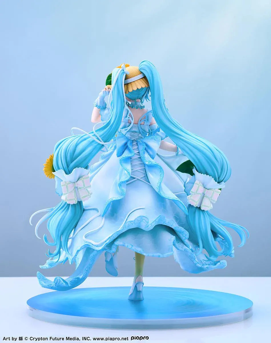Vocaloid Hatsune Miku Magical Mirai 2026 Ver. 1/7 scale figure wearing a flowing blue dress decorated with sunflowers and elegant ribbons