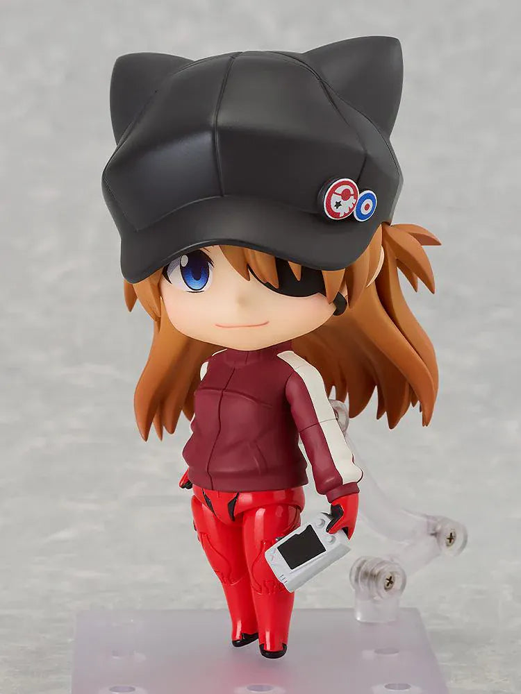 Rebuild of Evangelion Nendoroid Asuka Shikinami Langley Jersey Ver. Figure featuring Asuka in a chibi-style design with orange hair, black cat-ear cap, red jersey outfit, and eyepatch detail.