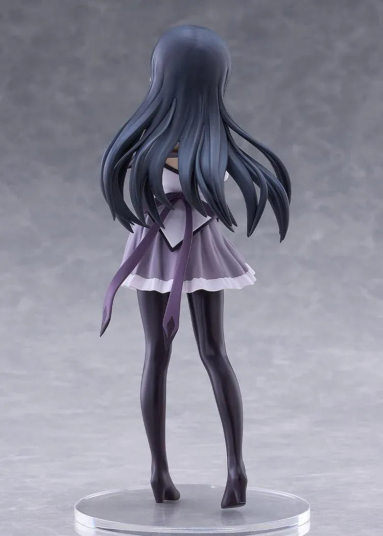Homura Akemi figure with long black hair, violet eyes, a white and purple outfit, and diamond-patterned stockings, smiling with one hand resting on her arm.