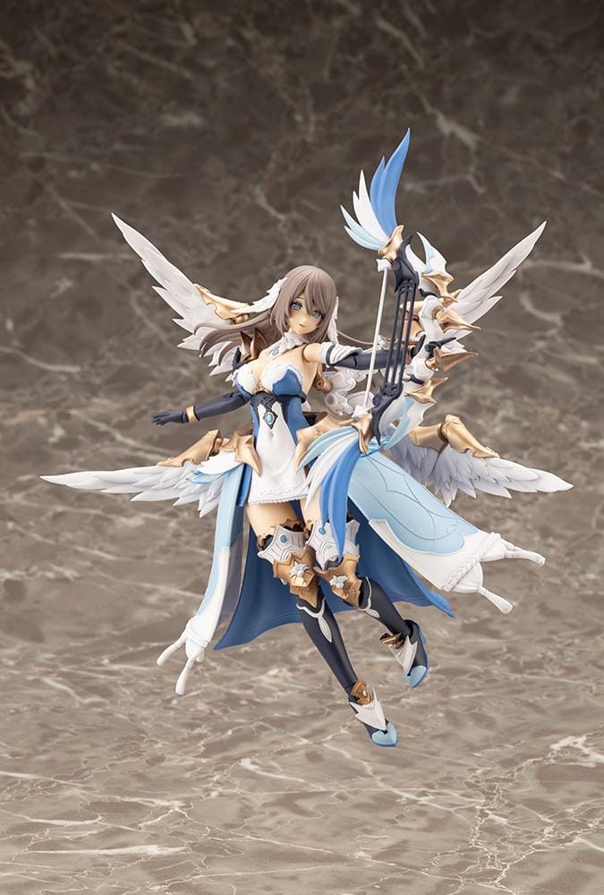 Assembled Arcanadea Ermeda model kit with long brown hair, white feathered wings, a blue and white outfit, gold armor accents, and armored boots.