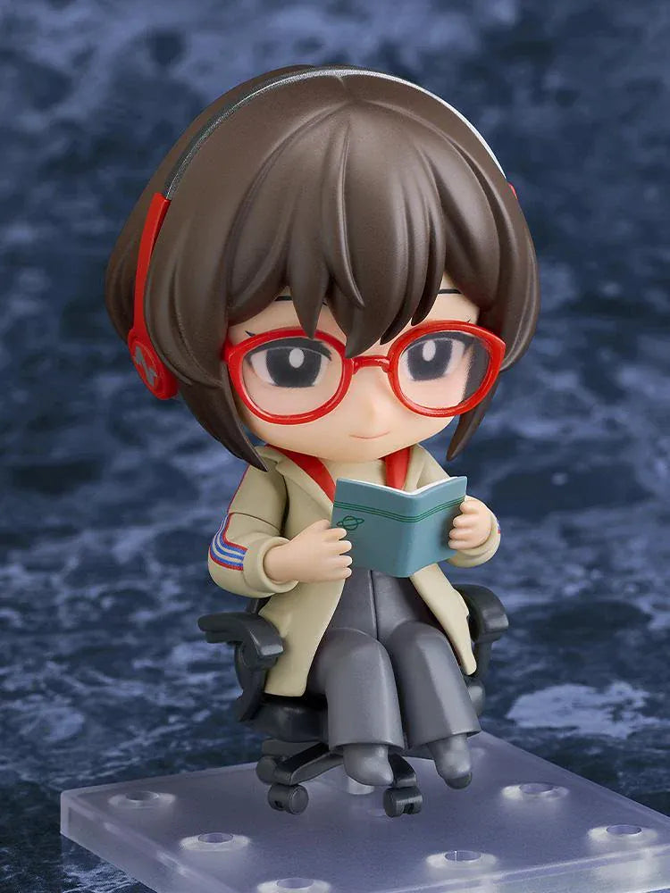 Nendoroid Satone figure seated in a black office chair, wearing red glasses, red headphones, a beige jacket, and dark gray trousers.