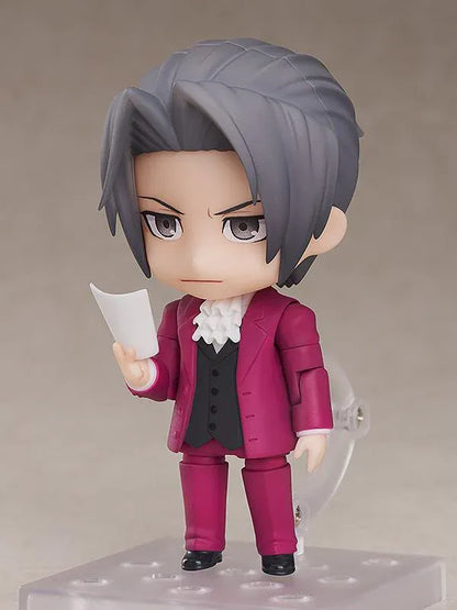 Ace Attorney Miles Edgeworth Nendoroid rerelease figure wearing a burgundy suit and pointing beside a Japanese Objection effect part.