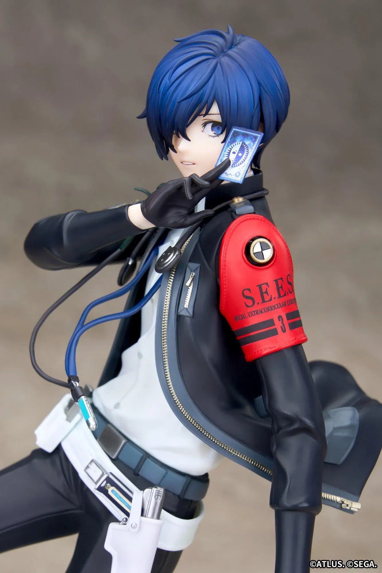 Persona 3 Reload Limepie Protagonist 1/8 Scale Figure with blue hair, black jacket, S.E.E.S. armband, headphones, and themed display base