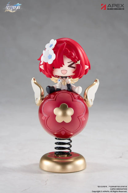 Honkai Star Rail Tribbie Chibi Chara Yurayura Stand Non-Scale Figure with red hair, flower details, red-and-gold spring base, and chibi design