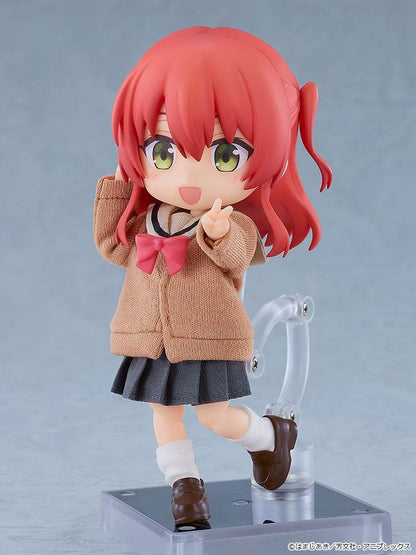 Bocchi the Rock Nendoroid Doll Ikuyo Kita featuring Kita with red hair, green eyes, a fabric cardigan outfit, skirt, socks, and loafers.