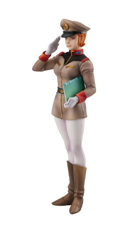 Gundam Girls Generation Matilda Ajan figure saluting in a tan military uniform and peaked cap, holding a green folder, with white trousers and brown boots.