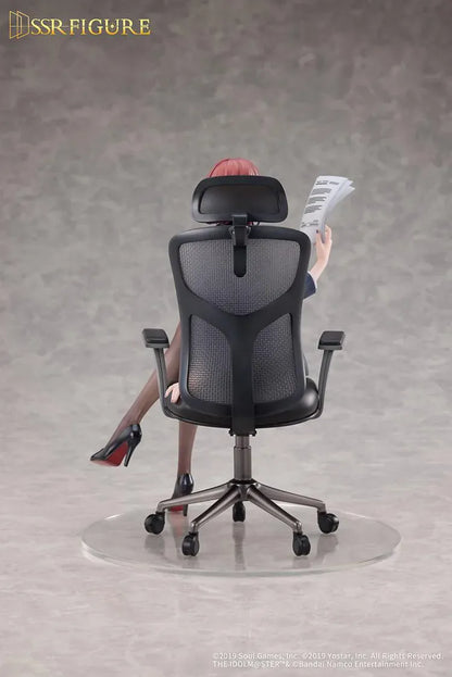 Madoka Higuchi Effortless Work Ver. figure seated in an office chair, wearing a navy blazer and holding papers above a clear circular base.