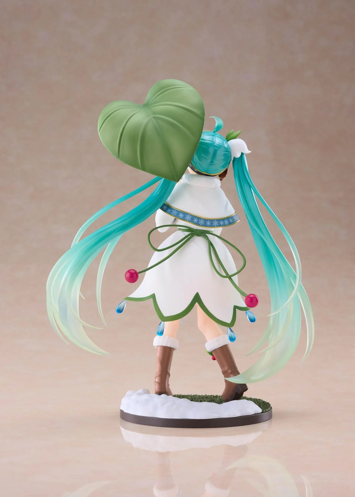 Snow Miku All Stars 2015 Ver. AMP+ figure wearing a white flower-inspired dress and holding an oversized green leaf.