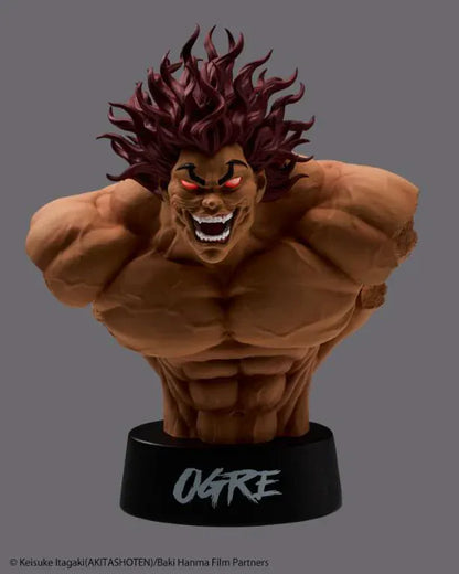 Baki The Grappler Taito Kuji Yujiro Bust Figure featuring Yujiro Hanma with muscular sculpting, wild red hair, fierce grin, and black OGRE display base.