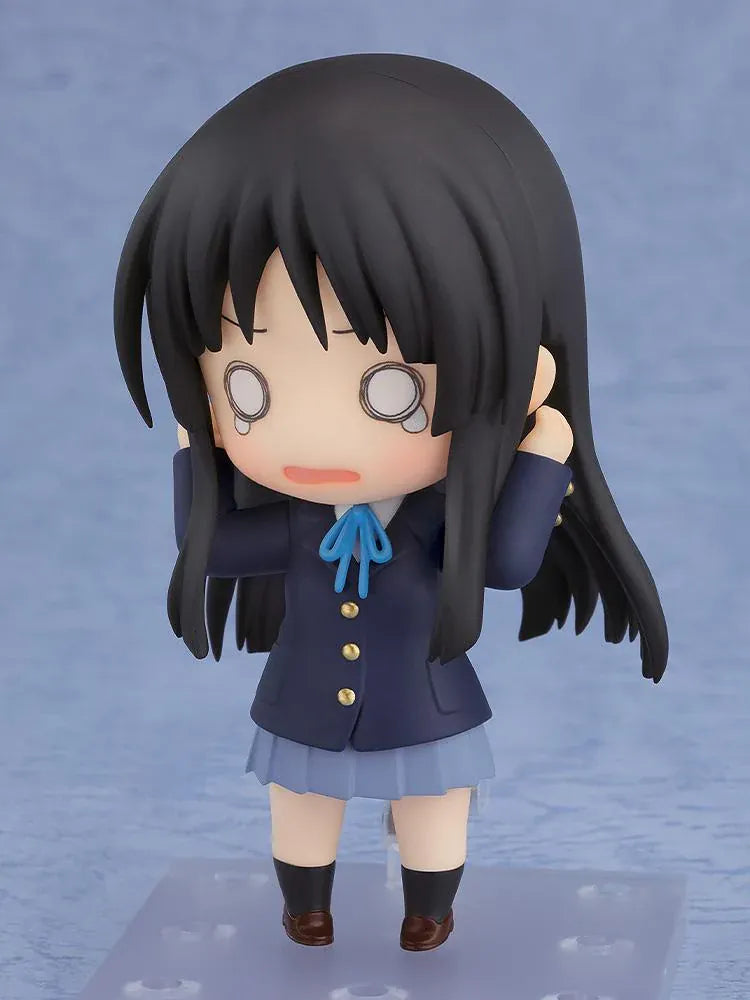 K-ON! Nendoroid Mio Akiyama 2.0 figure with long black hair, her school uniform, blue ribbon, and left-handed bass guitar.