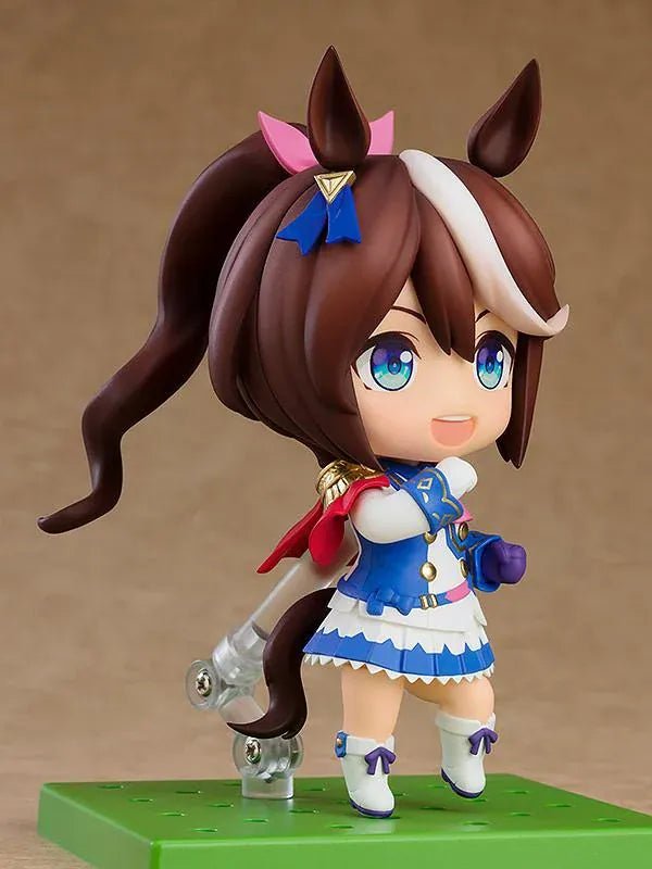 Umamusume Pretty Derby Nendoroid Tokai Teio rerelease figure with brown hair, a white forelock, pink bow, and blue-and-white racing uniform.