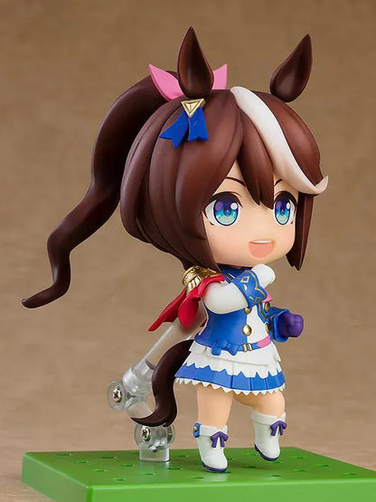 Umamusume Pretty Derby Nendoroid Tokai Teio rerelease figure with brown hair, a white forelock, pink bow, and blue-and-white racing uniform.