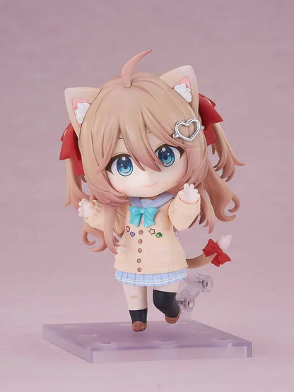 Neuro-sama Nendoroid figure with light brown hair, red ribbons, a heart hair clip, peach cardigan, turquoise bow, and a green turtle on her head.