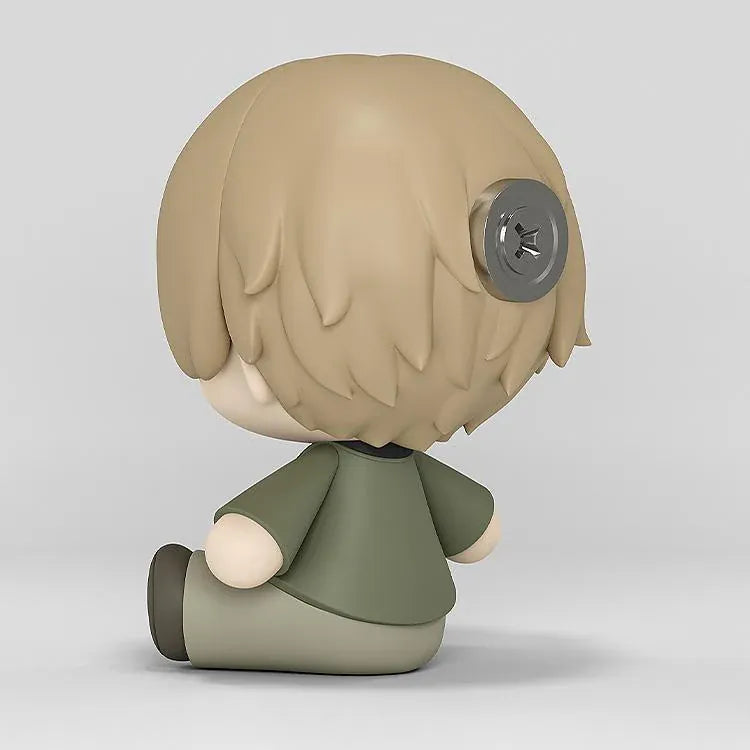Shuichi Natori Huggy Good Smile figure seated in a green jacket and glasses with a playful winking expression.