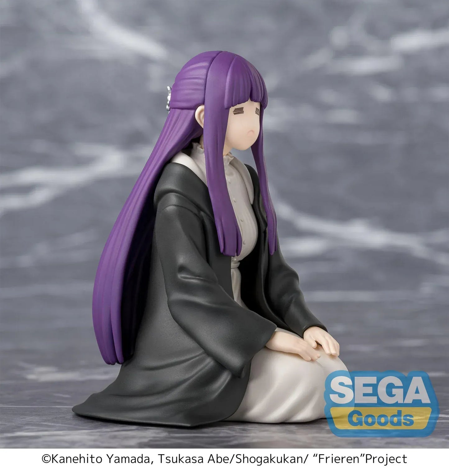 Perching figure of Fern from Frieren: Beyond Journey’s End kneeling calmly in robes, eyes closed in a binding spell pose, with long purple hair and a gray cloak.
