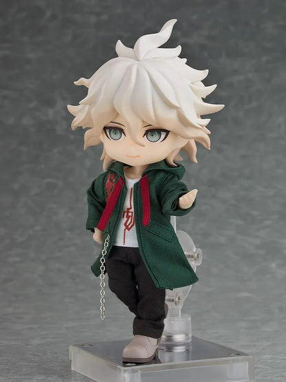 Danganronpa 2x2 Nendoroid Doll Nagito Komaeda with white hair, a dark green fabric coat, black trousers, gray shoes, and a silver-colored chain.