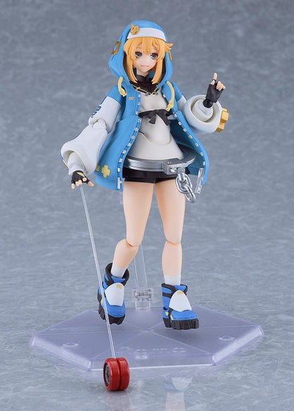 GUILTY GEAR STRIVE figma Bridget Figure featuring Bridget in a blue hoodie outfit with yo-yo accessory, oversized handcuff detail, and teddy bear companion.