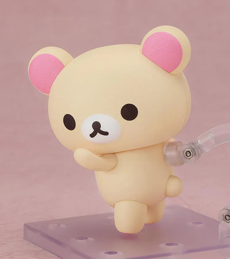 Rilakkuma Nendoroid Korilakkuma Figure with cream-colored bear design, pink ears, red button detail, white belly, and chibi display base