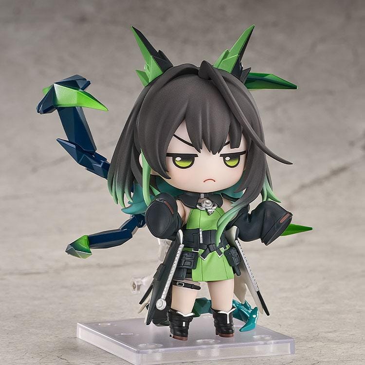 Arknights Nendoroid Mon3tr figure wearing a black-and-green tactical outfit with oversized gauntlets and crystalline appendages.