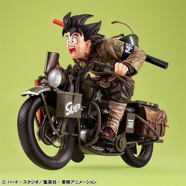 “Dragon Ball Z Desktop Real McCoy EX figure of Kid Goku riding a detailed military-style motorbike with gear and accessories.”