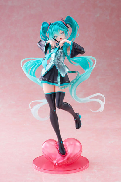 Hatsune Miku T-Most figure with flowing twin tails, classic Vocaloid outfit, and pink heart-shaped display base