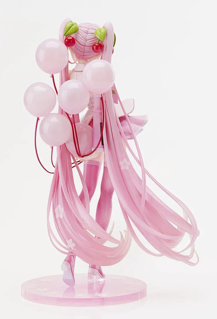 Sakura Miku figure with long pink twin-tails, cherry hair ornaments, a white and pink outfit, pink boots, and translucent balloons on a floral pink base.