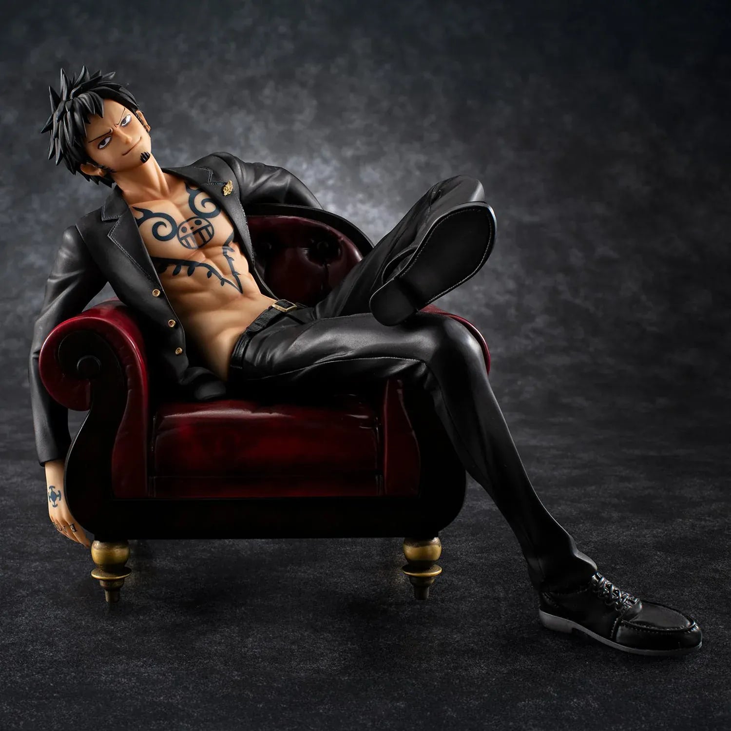 One Piece Portrait Of Pirates S.O.C. Trafalgar Law Ver. R Figure wearing a black suit and sitting in a red armchair