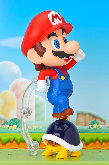 Super Mario Nendoroid Mario figure wearing his red hat and blue overalls in a running pose
