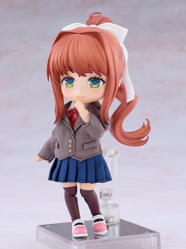 Doki Doki Literature Club! Nendoroid Doll Monika wearing a fabric brown blazer, blue pleated skirt, red ribbon, and white hair bow.