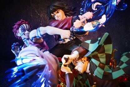 Demon Slayer Tanjiro Kamado, Giyu Tomioka, and Akaza vignette figure featuring translucent water and fire battle effects.