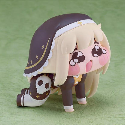 POP UP PARADE Petite Speaki figure with blonde hair, sparkling eyes, rosy cheeks, and a dark hood with gold accents and a skull detail.