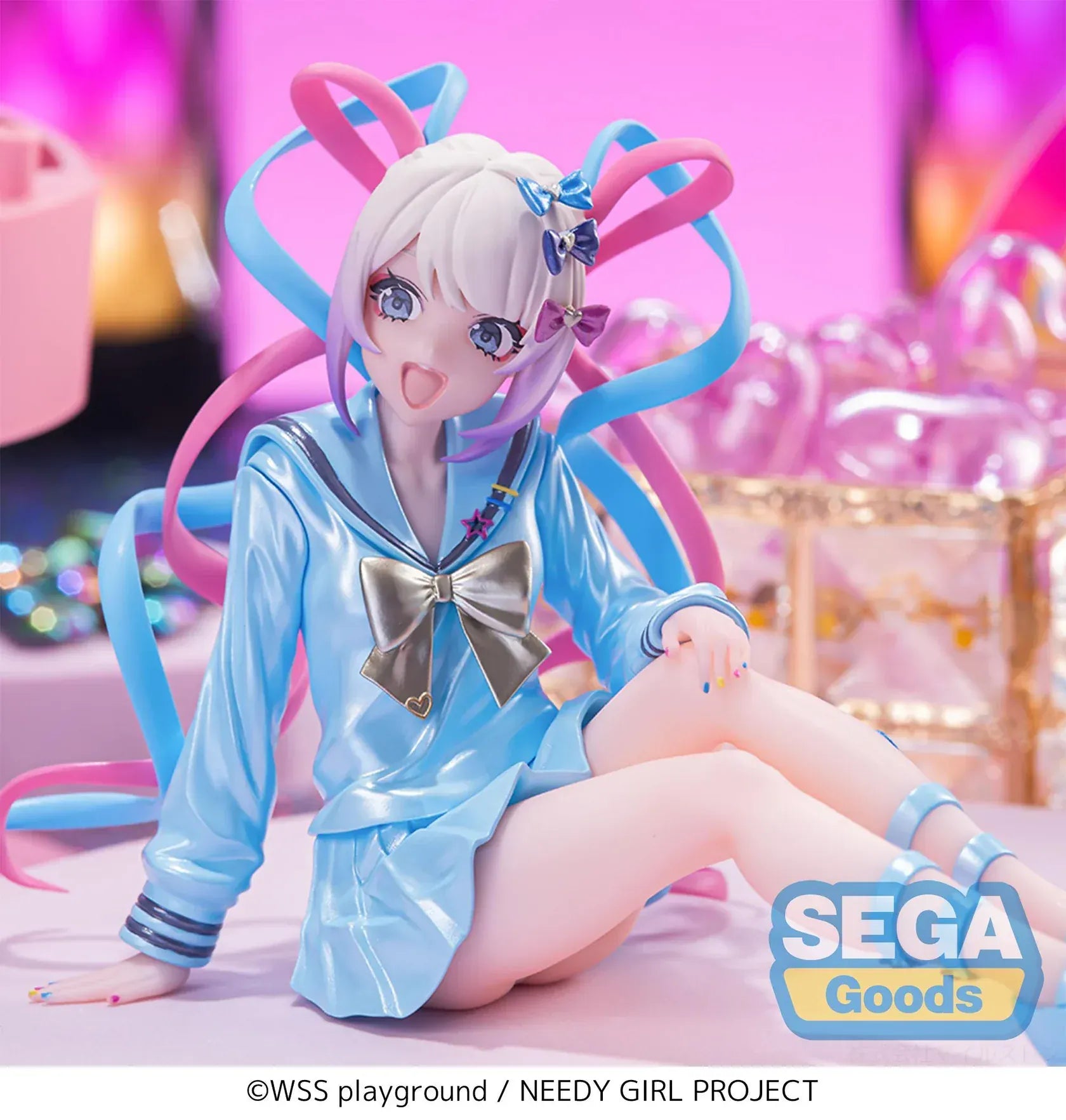 Figure of OMGKawaiiAngel sitting in a perching pose with pastel ribbons, glossy outfit, and energetic expression.