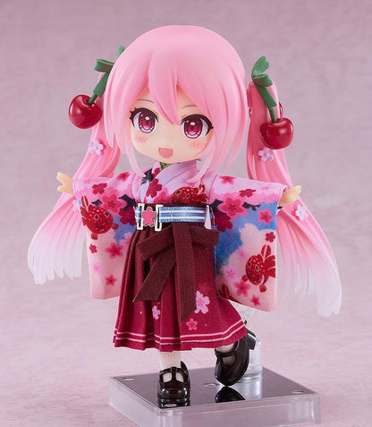 Hatsune Miku Nendoroid Doll Sakura Miku Hirohako 2025 Ver. Hirosaki featuring Sakura Miku with pink twin tails, cherry accessories, and a red and pink kimono-style outfit.