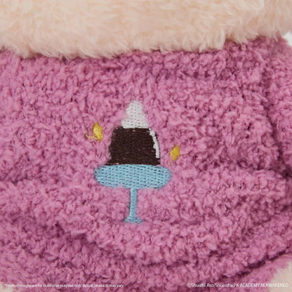 The Disastrous Life of Saiki K. Kusuo Saiki Fukamokogurumi Plushie featuring bright pink hair, green-tinted glasses, white psychic limiters with pink pom-poms, and a fluffy pink outfit with an embroidered coffee jelly design in a cute seated pose.