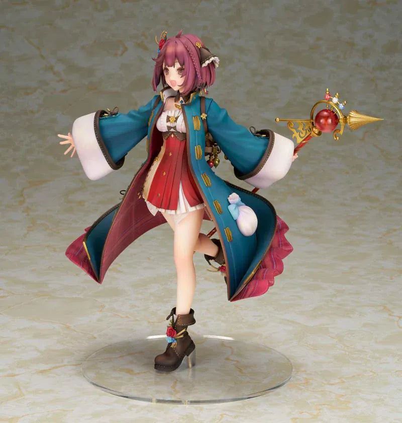 Sophie Neuenmuller figure smiling in a dynamic pose, wearing a teal coat over a red outfit and holding an ornate gold staff with a red orb.