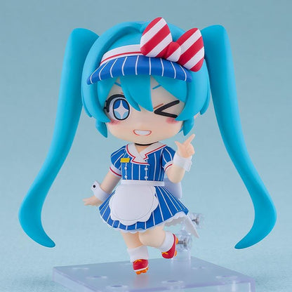 Hatsune Miku Nendoroid Hatsune Miku Mesmerizer Ver. Figure featuring Miku in a chibi-style design with teal twin tails, striped blue outfit, red and white bow, and apron-style details.