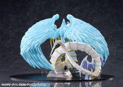 Yu-Gi-Oh! GX Rainbow Dragon figure with a pearlescent armored body, multicolored crystals, gold accents, and translucent blue wings.