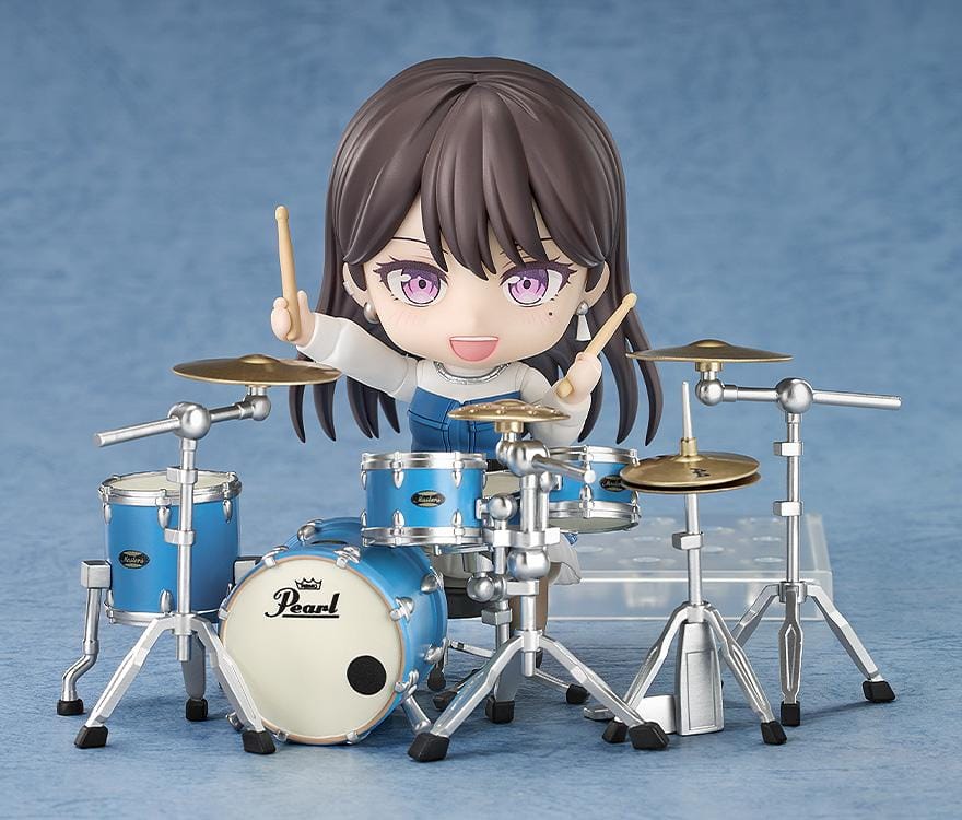 BanG Dream Nendoroid Taki Shiina Figure featuring Taki in a chibi-style design with long dark hair, purple eyes, blue outfit, and drumstick accessory.