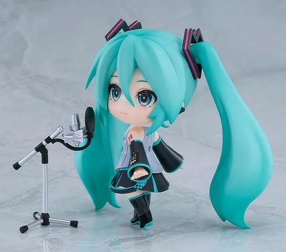 Hatsune Miku V6 Nendoroid figure with turquoise twin tails, an updated outfit, and interchangeable accessories.