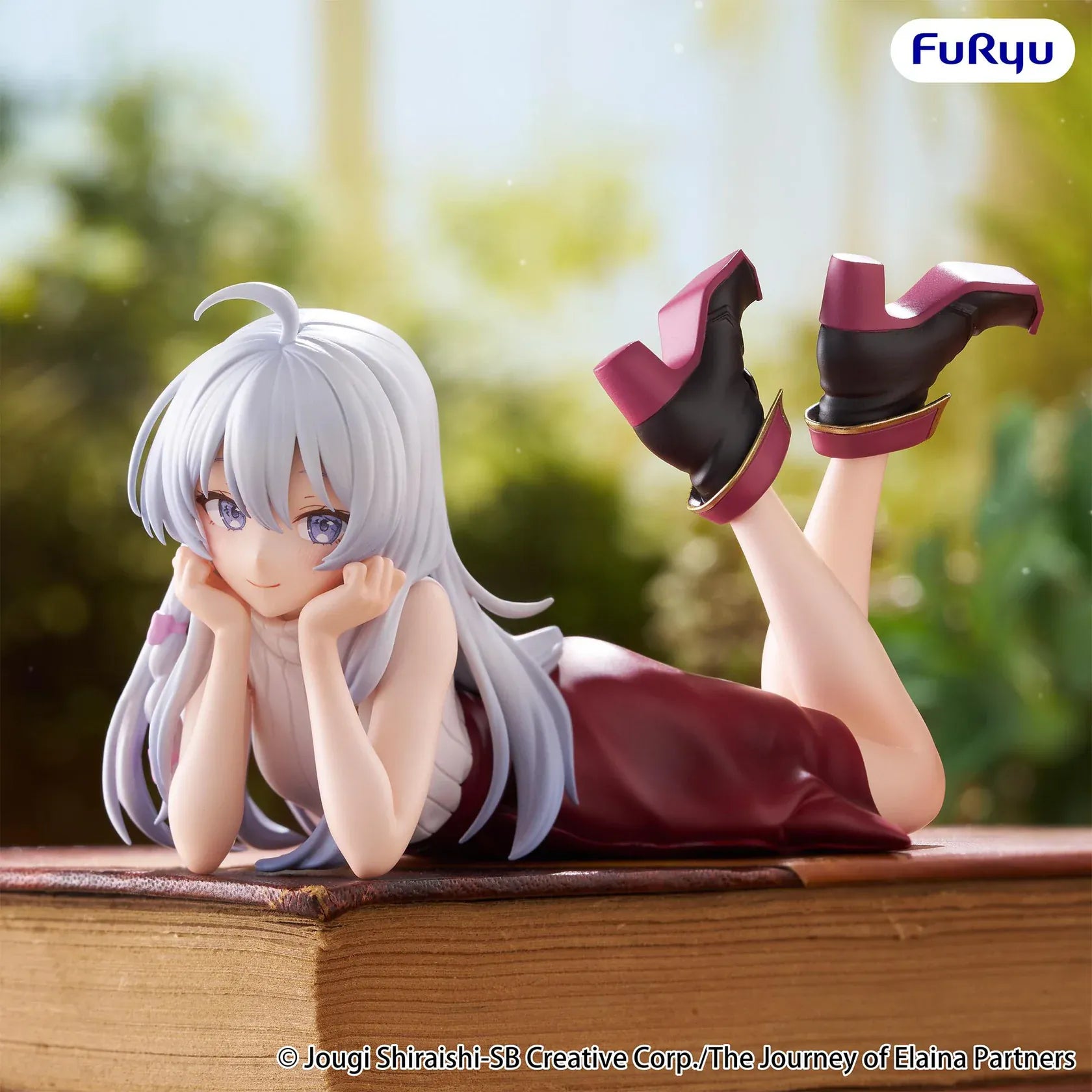 The Journey of Elaina Noodle Stopper Elaina Lying Down Ver. figure featuring silver hair, a relaxed lying pose, and an elegant outfit