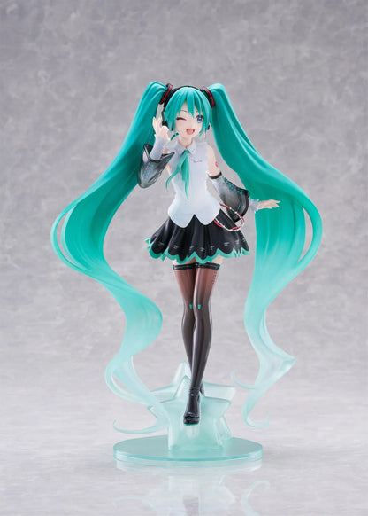 Vocaloid T-Most Hatsune Miku NT Ver. Figure featuring Miku with long teal twin tails, headphones, black-and-white outfit, wink expression, peace-sign pose, and star-themed base.