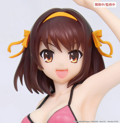 Vivit Haruhi Suzumiya figure wearing a pink swimsuit with black trim and yellow hair ribbons, smiling with one arm raised and one leg lifted.